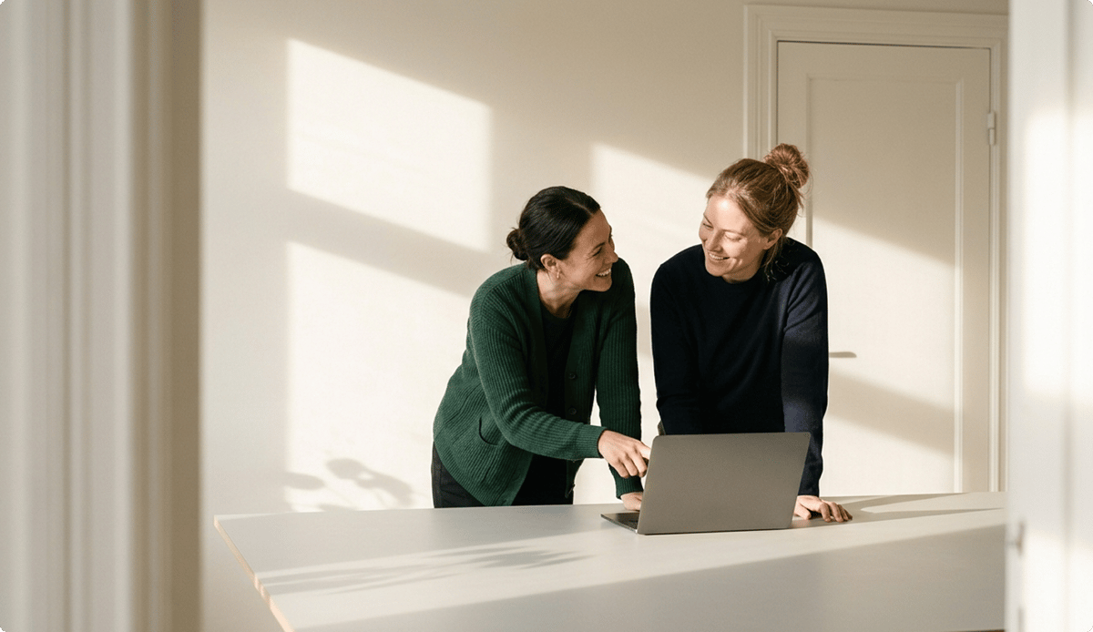 Two women looking at computer