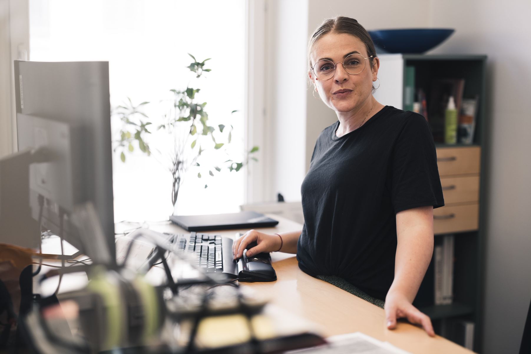 Anna Bjureblad production manager Comactiva standig at her desk